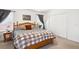 Bedroom featuring neutral walls, large windows, and a queen-sized bed at 18477 E Amherst Dr, Aurora, CO 80013