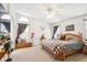 Bedroom features a ceiling fan and large windows for plenty of natural light at 18477 E Amherst Dr, Aurora, CO 80013