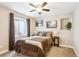 Comfortable bedroom with neutral walls, carpet floors, and a window with plenty of natural light at 18477 E Amherst Dr, Aurora, CO 80013
