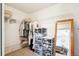 Walk-in closet with organized shelving and hanging rods for efficient storage; mirror on right wall at 18477 E Amherst Dr, Aurora, CO 80013
