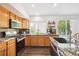 Well-equipped kitchen featuring granite countertops, stainless steel appliances, and ample cabinet space for cooking and storage at 18477 E Amherst Dr, Aurora, CO 80013