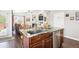 Charming kitchen with granite countertops, stainless steel appliances, and wood cabinets near the living area at 18477 E Amherst Dr, Aurora, CO 80013