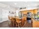 Well-lit kitchen featuring a center island, stainless steel appliances, and a pantry at 18477 E Amherst Dr, Aurora, CO 80013