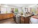 Spacious kitchen with granite counters, stainless steel appliances, and wood cabinets, offering functionality and style at 18477 E Amherst Dr, Aurora, CO 80013