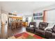 Open concept living area showcases the kitchen and comfortable seating at 18477 E Amherst Dr, Aurora, CO 80013
