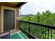 Outdoor balcony with a black railing, stone columns and beautiful mountain views at 8726 S Kline St # A204, Littleton, CO 80127