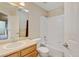 Bathroom with tiled shower over tub and single sink with vanity and good lighting at 8726 S Kline St # A204, Littleton, CO 80127