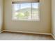 Bright bedroom featuring a large window with picturesque mountain views at 8726 S Kline St # A204, Littleton, CO 80127