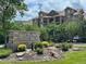 Chatfield Bluffs: Covenant controlled community, complete with well-manicured landscaping, a stone sign, and lovely trees at 8726 S Kline St # A204, Littleton, CO 80127