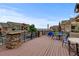 Spacious wooden deck with comfortable seating, offering panoramic views and a relaxing outdoor living space for residents at 8726 S Kline St # A204, Littleton, CO 80127