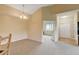 Dining room next to the kitchen and bedroom with carpet and neutral decor at 8726 S Kline St # A204, Littleton, CO 80127