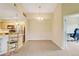 Dining room next to the kitchen and office with neutral decor and natural lighting at 8726 S Kline St # A204, Littleton, CO 80127