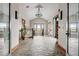 Hallway featuring stone floors, natural lighting, and views of the outdoors, creating a welcoming and luxurious entrance at 8726 S Kline St # A204, Littleton, CO 80127