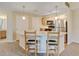 Eat-in kitchen featuring a breakfast bar, stainless steel appliances, and modern lighting at 8726 S Kline St # A204, Littleton, CO 80127