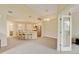 Spacious area includes an open view from the living space to the dining room, kitchen and hallway at 8726 S Kline St # A204, Littleton, CO 80127