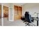 Office space featuring a built-in bookcase, desk, and ergonomic chair at 8726 S Kline St # A204, Littleton, CO 80127