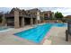 Community pool with ample seating and an adjacent spa, providing residents with a relaxing and luxurious amenity at 8726 S Kline St # A204, Littleton, CO 80127