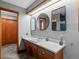 Bathroom features a double vanity with a modern design at 1750 Vance St, Lakewood, CO 80214