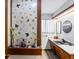 Unique bathroom with decorative glass wall and mid-century vanity at 1750 Vance St, Lakewood, CO 80214