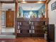 Built-in wooden bookcase with numerous books and decorative items at 1750 Vance St, Lakewood, CO 80214