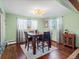 Light and airy dining room with hardwood floors and a wooden table at 1750 Vance St, Lakewood, CO 80214