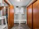 Laundry area with built-in bench and herringbone tile floor at 1750 Vance St, Lakewood, CO 80214