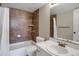 Bathroom featuring white vanity, mirror, and tiled shower with a white shower curtain at 3675 S Cherokee St # 110, Englewood, CO 80110