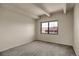 Neutral bedroom has large window, carpeted floors, and plenty of space at 3675 S Cherokee St # 110, Englewood, CO 80110