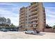 Exterior of the condo building featuring many balconies and parking at 3675 S Cherokee St # 110, Englewood, CO 80110