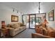Comfortable lobby with sofa, chairs, artwork, and glass doors to exterior at 3675 S Cherokee St # 110, Englewood, CO 80110