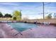 Outdoor pool area with brick patio, several grills, and ample seating for entertaining guests at 3675 S Cherokee St # 110, Englewood, CO 80110