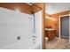 Bathroom featuring white tile in the shower and a wooden vanity at 2554 S Laredo Ct, Aurora, CO 80013