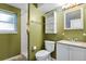 Bathroom with green walls, shower and white vanity at 2554 S Laredo Ct, Aurora, CO 80013