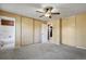 Neutral bedroom with plush carpet and large closets, leading to a bathroom at 2554 S Laredo Ct, Aurora, CO 80013