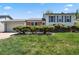 Charming home featuring a well-manicured lawn and trimmed shrubbery in the front yard at 2554 S Laredo Ct, Aurora, CO 80013