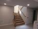 Basement stairway leading to an finished basement with modern design features at 1970 S Logan St, Denver, CO 80210