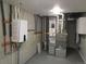Basement mechanicals including furnace, water heater, and ductwork at 1970 S Logan St, Denver, CO 80210