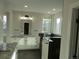 Luxurious bathroom featuring double sink vanity, granite countertop, and a large glass enclosed walk in shower at 1970 S Logan St, Denver, CO 80210