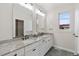 Modern bathroom with dual vanities, quartz countertops, and chrome fixtures at 1970 S Logan St, Denver, CO 80210