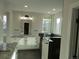 Bathroom featuring glass shower, quartz countertops, and ample counter space at 1970 S Logan St, Denver, CO 80210