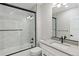 Modern bathroom with black hardware, white subway tile, and glass shower door at 1970 S Logan St, Denver, CO 80210