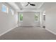 Large, bright bedroom with tray ceilings and a view to the ensuite bathroom at 1970 S Logan St, Denver, CO 80210