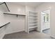 Walk-in closet with shelving and black hardware looking into the ensuite bath at 1970 S Logan St, Denver, CO 80210