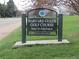 Sign for Harvard Gulch Golf Course, featuring a well-manicured green and recreational amenities, open to the public at 1970 S Logan St, Denver, CO 80210