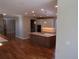 Open-concept kitchen featuring a large island, modern lighting, and seamless flow to the living area at 1970 S Logan St, Denver, CO 80210