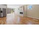 Bright living area with hardwood floors, modern fireplace, and sliding glass doors offering access to outdoor space at 1970 S Logan St, Denver, CO 80210