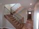 Elegant staircase with dark metal railings and wooden steps, leading to the upper level of the home at 1970 S Logan St, Denver, CO 80210