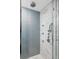 Modern bathroom with walk-in shower, rainfall shower head and marble tile at 105 Fillmore St # 204, Denver, CO 80206