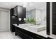 Luxurious bathroom with double vanity, marble tile, and ample storage at 105 Fillmore St # 204, Denver, CO 80206