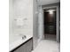 Spa-like bathroom with soaking tub, glass shower, and walk-in closet at 105 Fillmore St # 204, Denver, CO 80206
